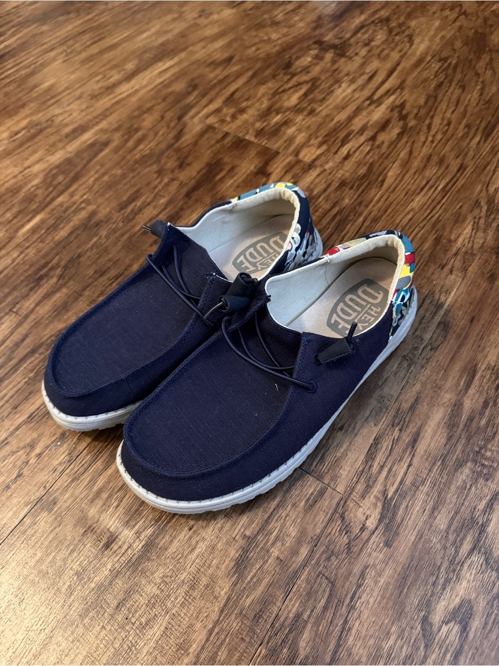 Women’s Hey Dude Navy Canvas Slip-Ons with Colorful Patterned Heel